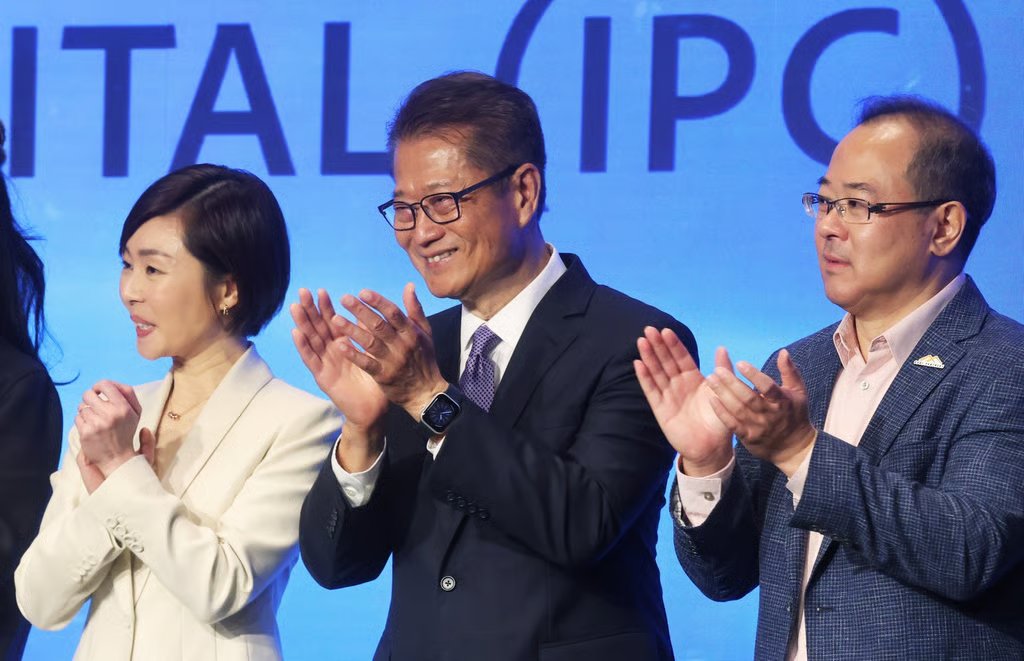 HKIC CEO Clara Chan Ka-chai (left) and Financial Secretary Paul Chan (centre). Photo: Jonathan Wong