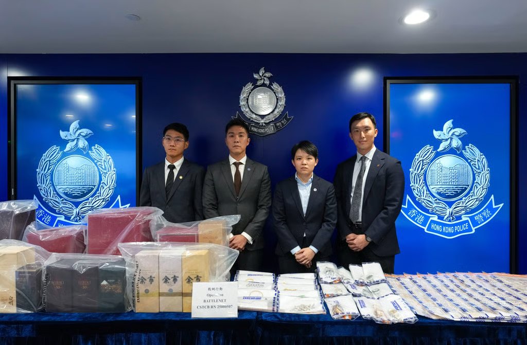 Police display items seized in a series of operations targeting deception and money laundering. Photo: Jelly Tse