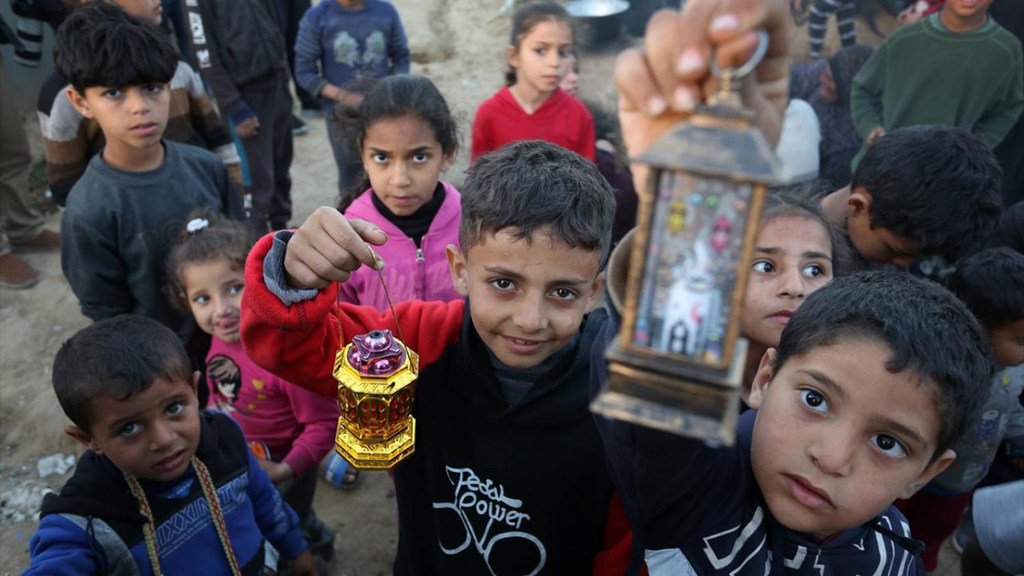 Children in Gaza hold lanterns to celebrate the advent of Ramadan.