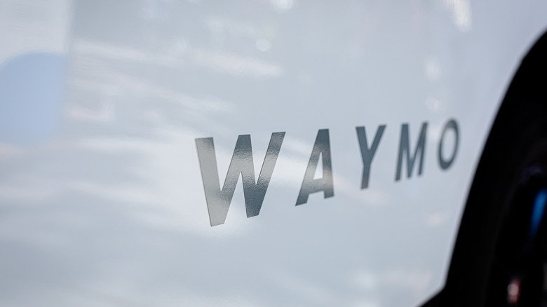 waymo logo on the side of a car