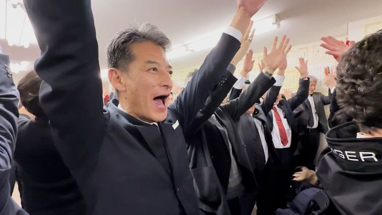 Supporters of Takaichi's LDP cheer as the election results are announced