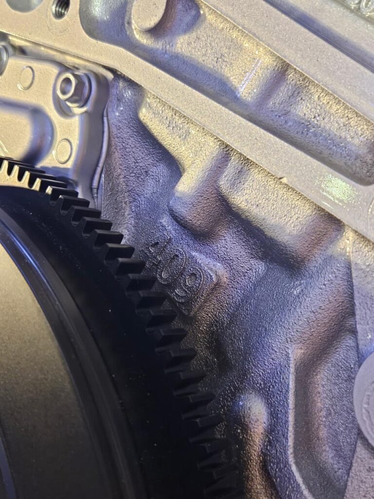 closeup of a ls6 v8 with a visible numerical engraving of 409