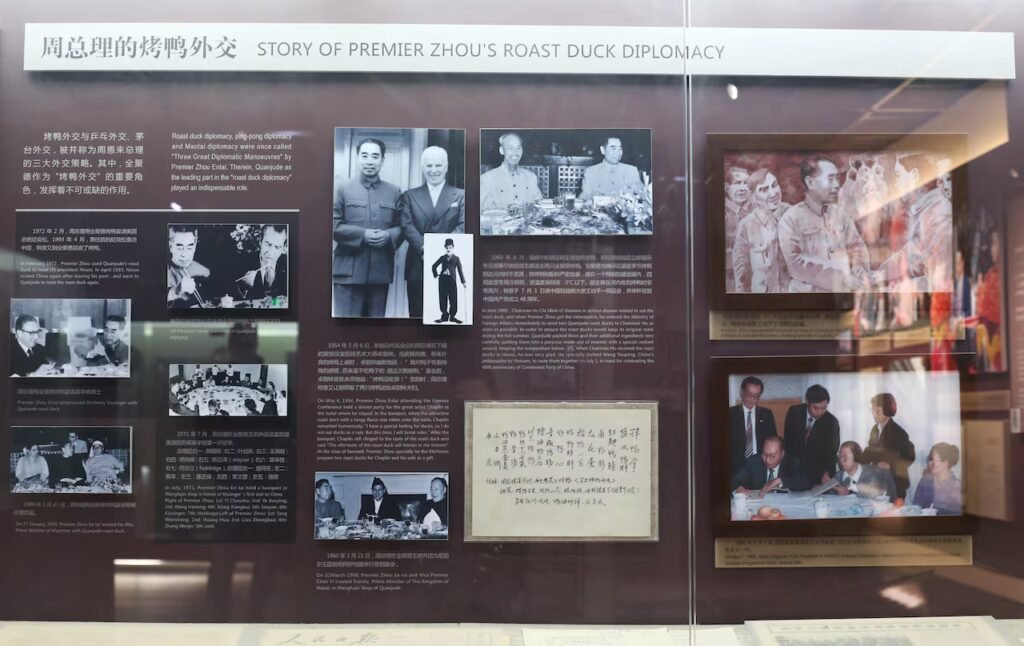 A display case that includes photos and articles on the idea of 'roast duck diplomacy.'