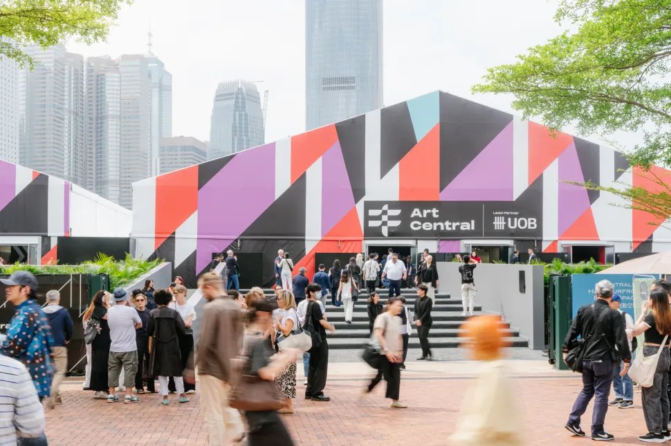 Crowds gather at the entrance of Art Central 2026 in Hong Kong, with the fair's bold geometric branding and UOB lead partner signage visible against the Central skyline.
