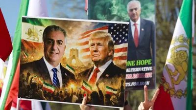 Demonstrators hold up an image of  Reza Pahlavi, son of the last shah of Iran, and US President Donald Trump as they rally in support of Iranians' fight for freedom, on the National Mall in Washington, DC, on March 29, 2026. (AFP)