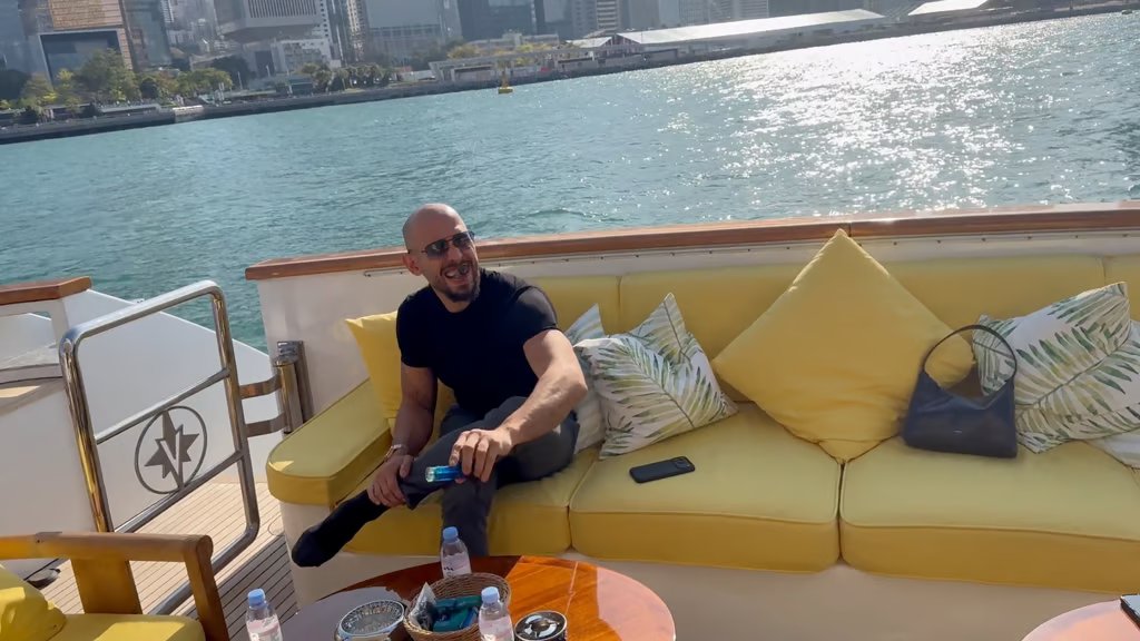 Andrew Tate on a boat in Victoria Harbour. Photo: X / Andrew Tate