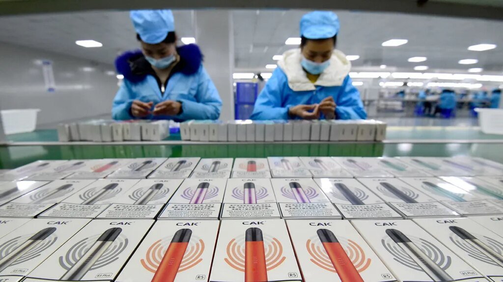 Workers package e-cigarettes.