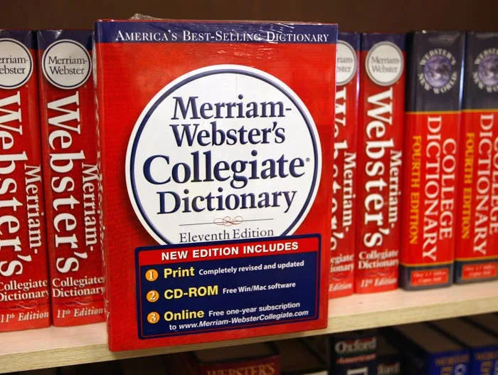 Merriam-Webster's Collegiate Dictionary, Eleventh Edition, showcased on a shelf with features like print and CD-ROM options highlighted