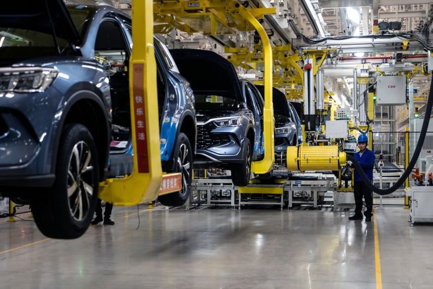 Electric vehicles on the assembly line at the BYD factory in Zhengzhou, China, on November 5, 2025.