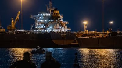 The Albina bulk carrier sits anchored at Sultan Qaboos Port in Muscat, Oman, near the Strait of Hormuz.