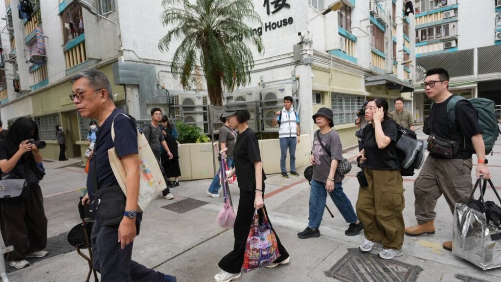 Residents leave prayers and flowers on third day of return to Wang Fuk Court