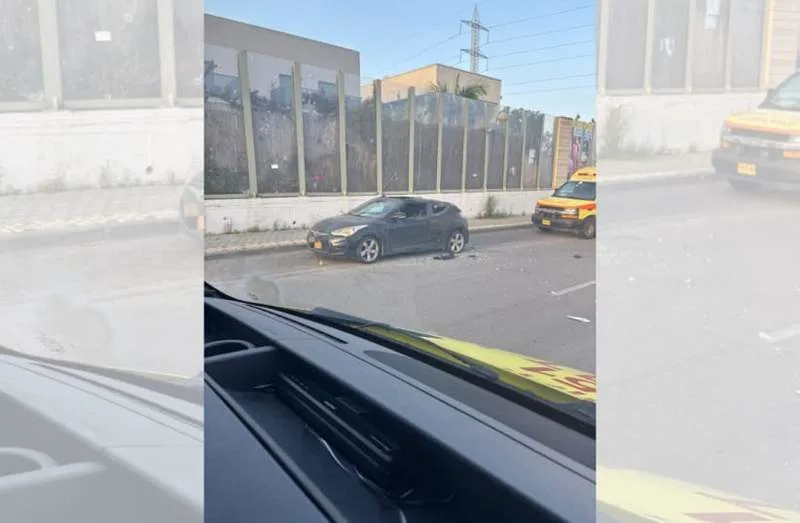 A vehicle damaged on the highway after being hit by shrapnel from an intercepted Iranian missile, near Petah Tikva, April 6, 2026. (credit: MAGEN DAVID ADOM)
