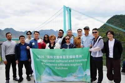 2026 "International Cultural Tourism Experience Officers Explore Guizhou" check in at China Guizhou Huajiang Canyon Bridge.