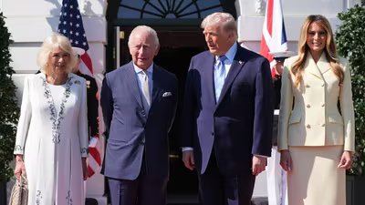 President Donald Trump and first lady Melania Trump greet Britain's King Charles III and Queen Camilla as they arrive at the White House (AP)