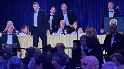 US Secret Service agents surround President Donald Trump before he was taken from the stage after a shooting incident outside the ballroom during the White House Correspondents Dinner, Saturday, April 25, 2026, in Washington. (AP)