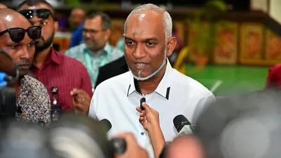 Maldives' President Mohamed Muizzu addresses the media at a polling station in Malé on April 4 during voting for local council elections as well as a referendum on holding Presidential and Parliamentary elections. (AFP)