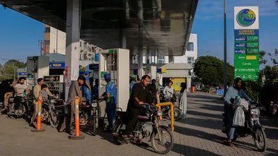 People get fuel at a petrol station, as fuel prices in Pakistan rise, amid the US-Israeli conflict with Iran, in Karachi. (REUTERS)