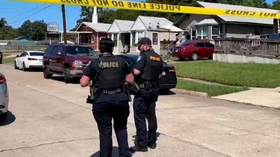 Police officers secure a street where eight children, with ages ranging from 1 to 14, were killed in a mass shooting in Shreveport, Louisiana. (via REUTERS)