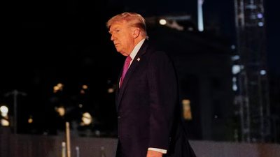 U.S. President Donald Trump walks after exiting Marine One on the South Lawn while returning to the White House in Washington. (REUTERS)