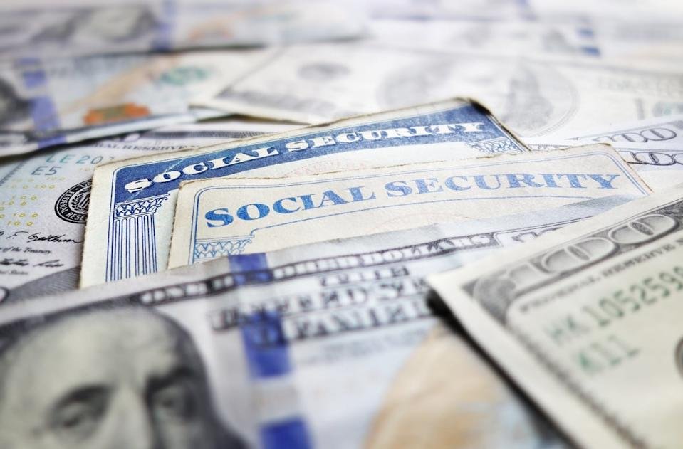 Social Security cards and hundred dollar bills.