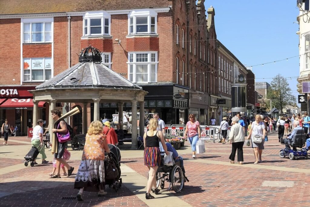People walk the street in Worthing