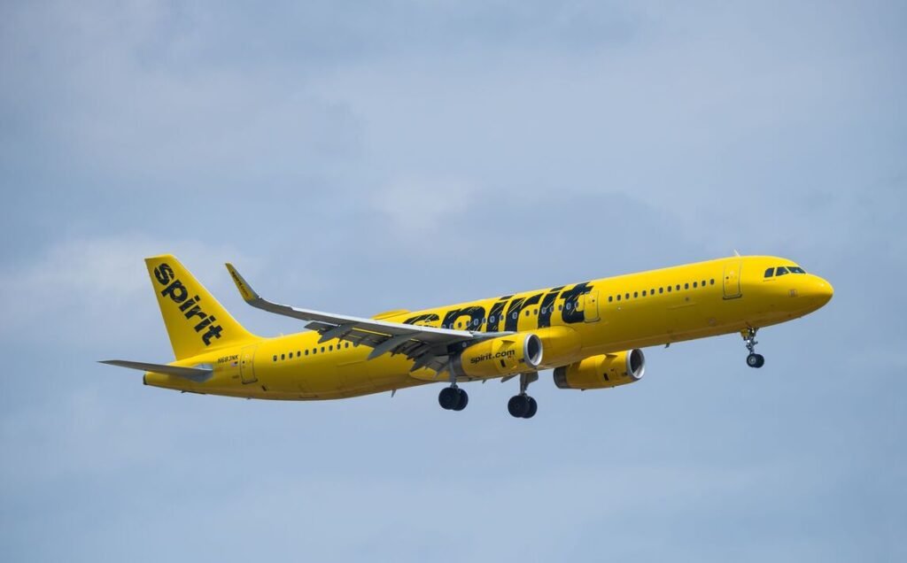 Spirit Airlines airborne over Dallas Fort Worth International Ai