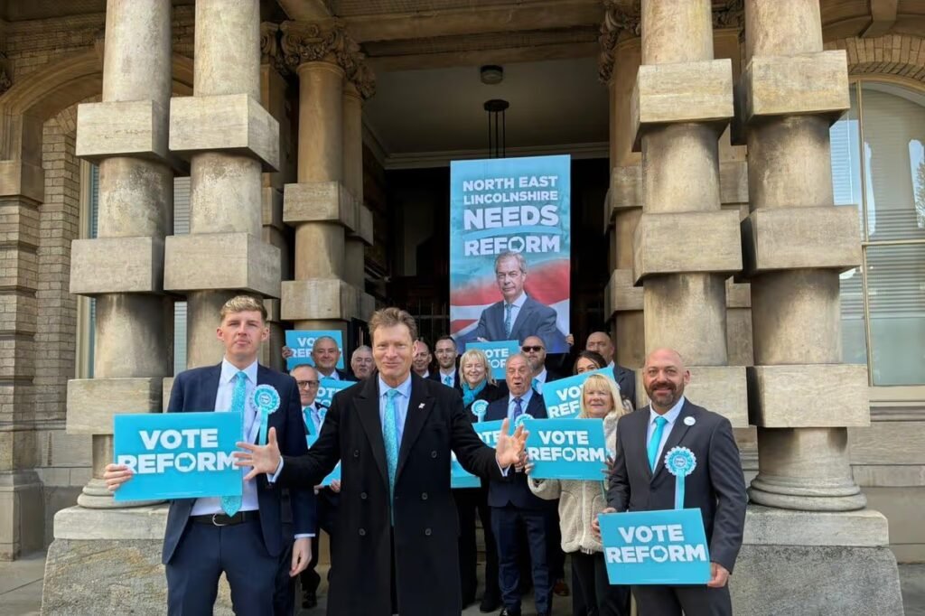 Reform UK's candidates in North East Lincolnshire local elections, with the party's deputy leader, Richard Tice, centre, at their campaign launch in April