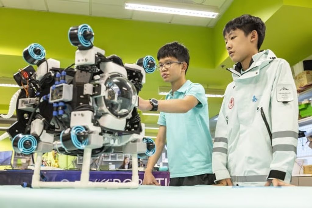 According to Lucas (left), the team’s chief technology officer, OctoScope is a modular autonomous underwater vehicle with interchangeable sensors and an octopus-inspired gripper.