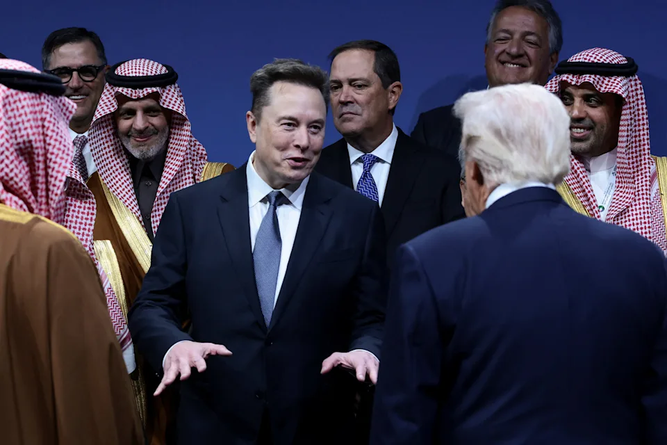 President Donald Trump and Elon Musk interact during the U.S.-Saudi Investment Forum in Washington, D.C., U.S., November 19, 2025.