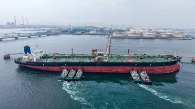 A cargo ship unloads imported crude oil at the Qingdao crude oil terminal in Chinas eastern Shandong province. (AFP)