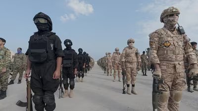 Members of the Islamic Revolutionary Guard Corps (IRGC) attend an exercise in southern Iran, in this handout image.