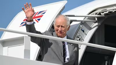 Britain's King Charles III waves as he boards his plane at Joint Base Andrews in Maryland (Reuters)