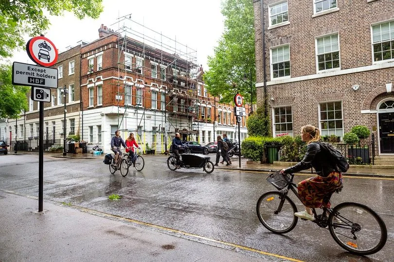 Cyclists ride in a traffic-controlled zone in Highbury, Islington