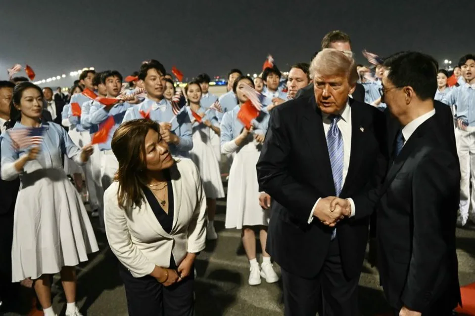 US President Donald Trump (C) is greeted by China's Vice President Han Zheng