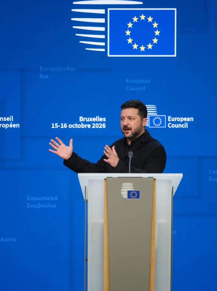 Ukrainian President Volodymyr Zelenskyy speaks at a podium during an EU Summit at the European Council in Brussels.