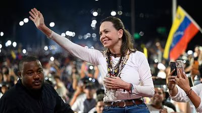 María Corina Machado greets supporters upon her arrival in Caracas on Oct. 25, 2026.